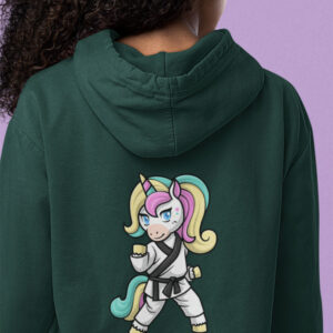girl wearing green hoodie with karate unicorn art
