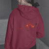 woman in red hoodie with dragon art