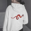 woman in white hoodie with dragon art