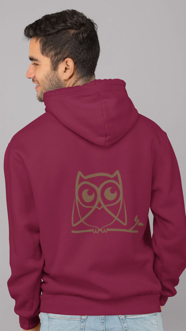 woman in red hoodie with brown owl art