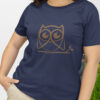 woman in blue shirt with brown owl art
