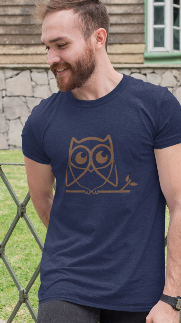 man in blue shirt with brown owl art
