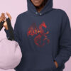 woman in grey hoodie with red dragon art