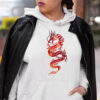 woman in white hoodie with red dragon art