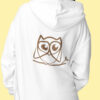 woman in white hoodie with brown owl art