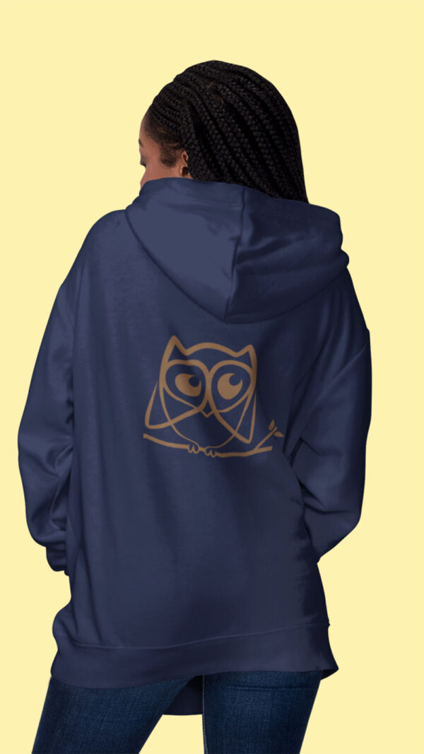 woman in blue hoodie with brown owl art