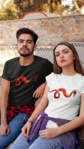 man and woman in shirts with dragon art