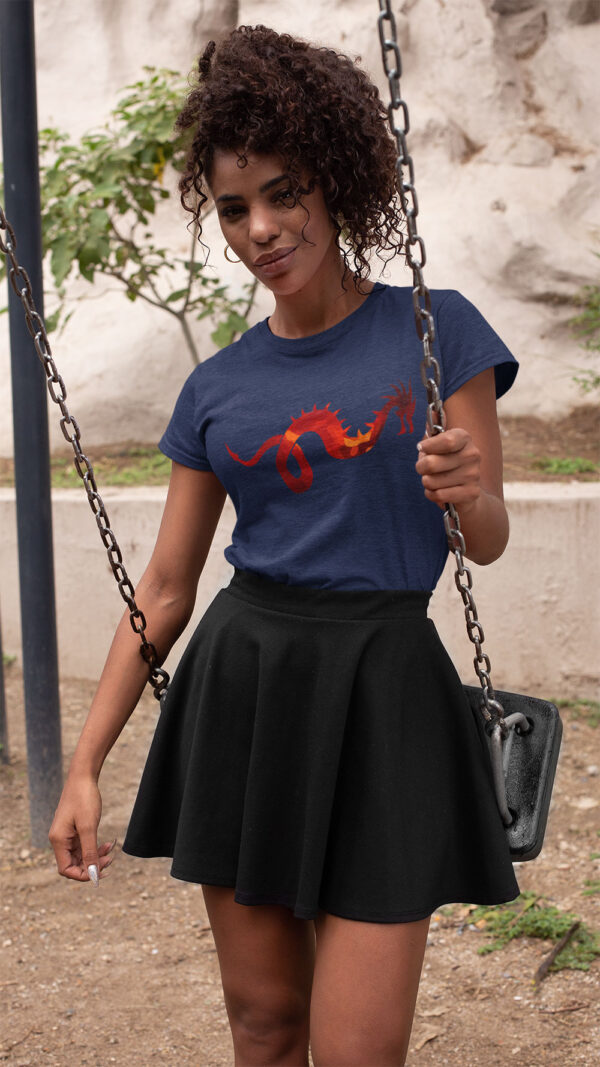 woman in blue shirt with dragon art on swing