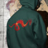 man in green hoodie with dragon art
