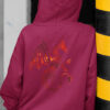 women in red hoodie with red dragon art