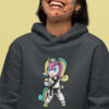 woman wearing gray hoodie with karate unicorn art and stickers on her face