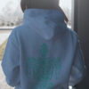 woman in blue hoodie with green turtle art