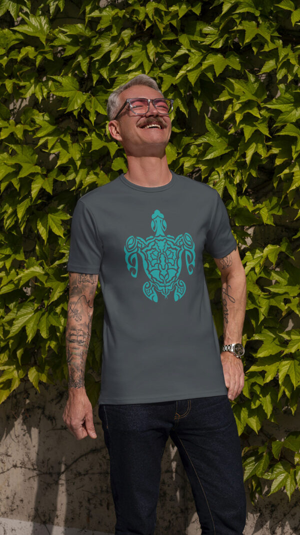 man in grey shirt with green turtle art