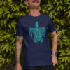 man in blue shirt with green turtle art