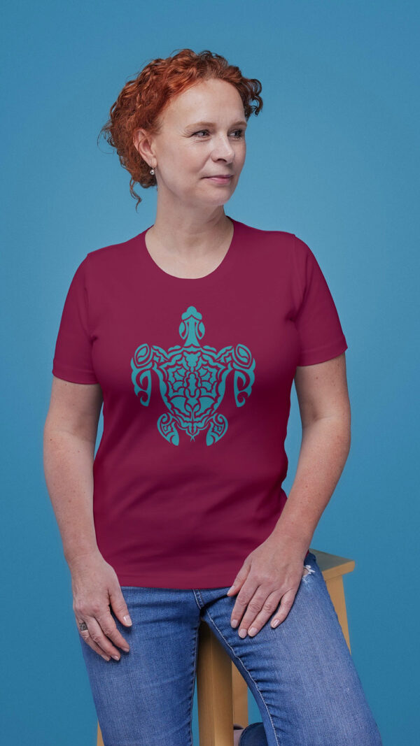 woman in red shirt with green turtle art