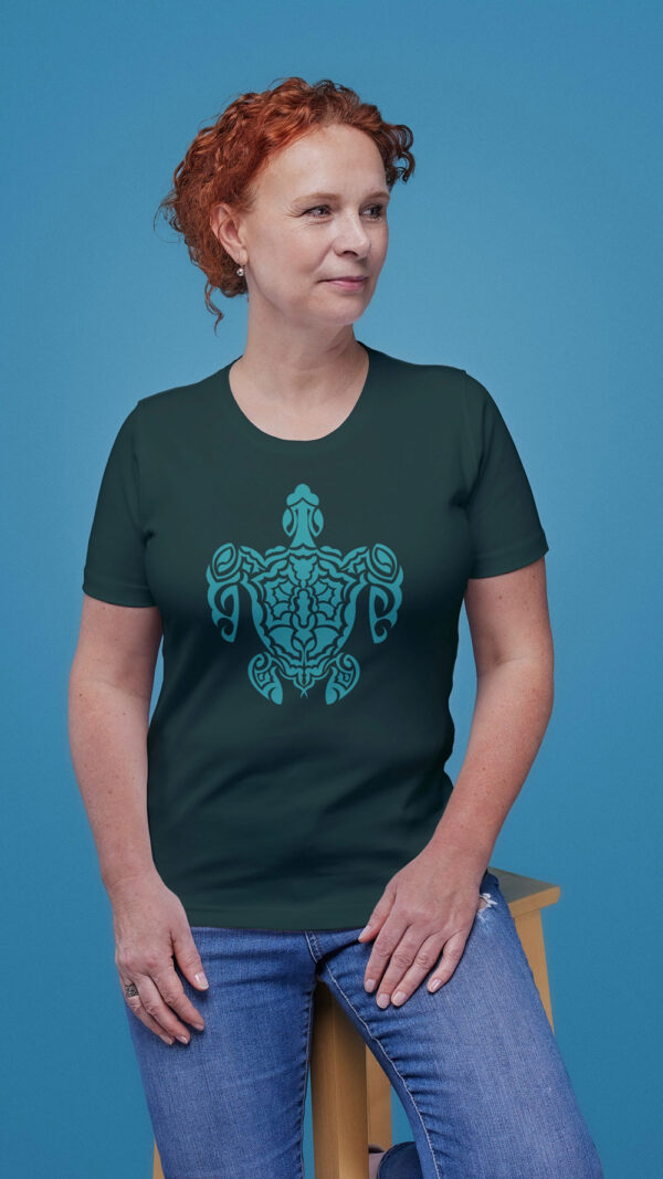 woman in green shirt with green turtle art