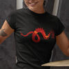 woman in black shirt with dragon art playing drums
