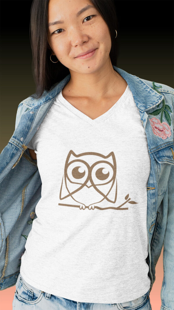 woman in white shirt with brown owl art