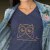 woman in blue shirt with brown owl art