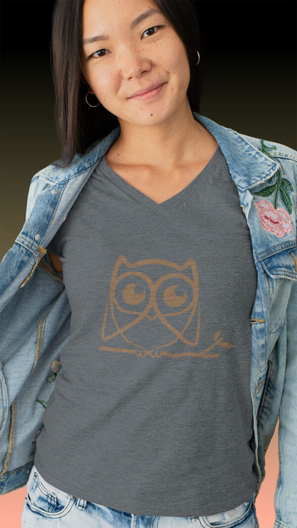 woman in grey shirt with brown owl art