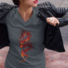 woman in grey shirt with red dragon art