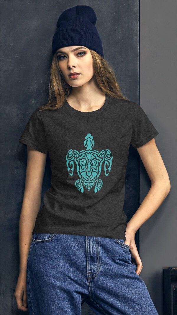 woman in grey shirt with green turtle art