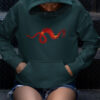 red dragon art on green hoodie on person