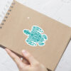 Turtle sticker on notepad